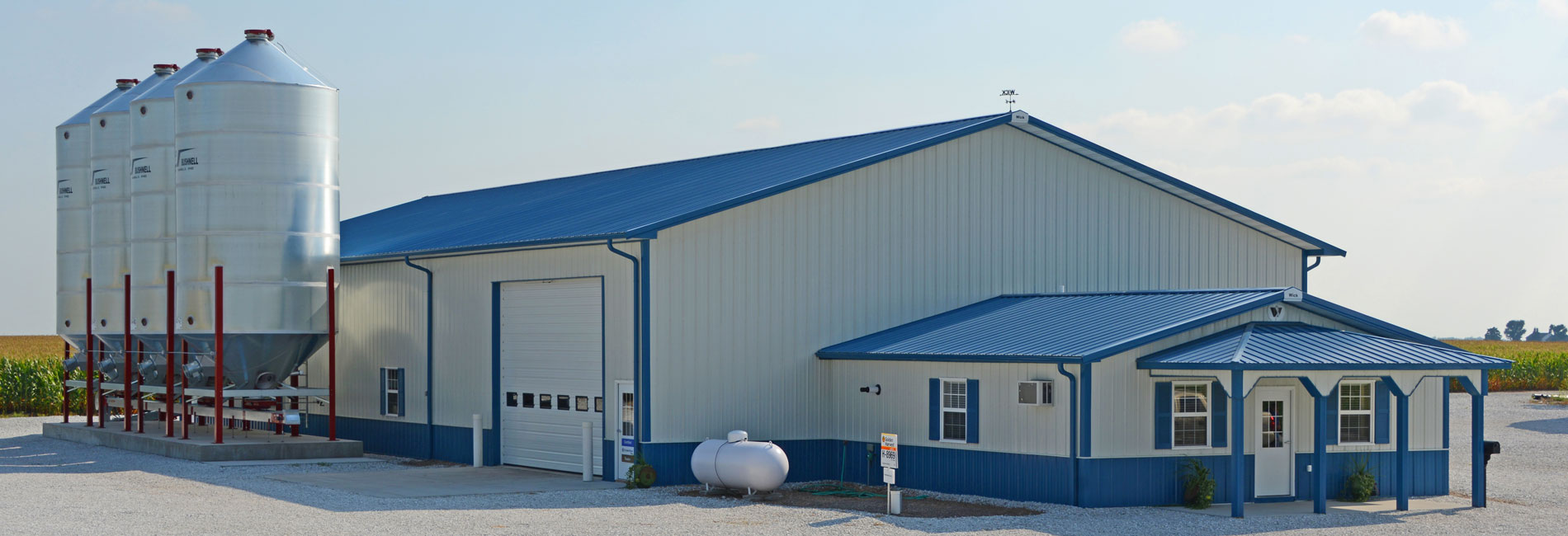 white and blue agricultural building